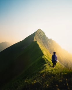 Walking the Tannhorn ridge at sunrise above the Brienzergrat