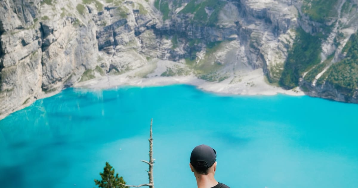 The turquoise Oeschinensee below the Bluemlisalp wall above Kandersteg.